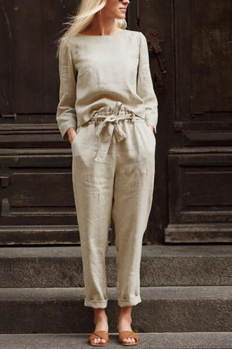 Woman wearing a beige 100 cotton linen monochrome two-piece set with long sleeves and drawstring pants