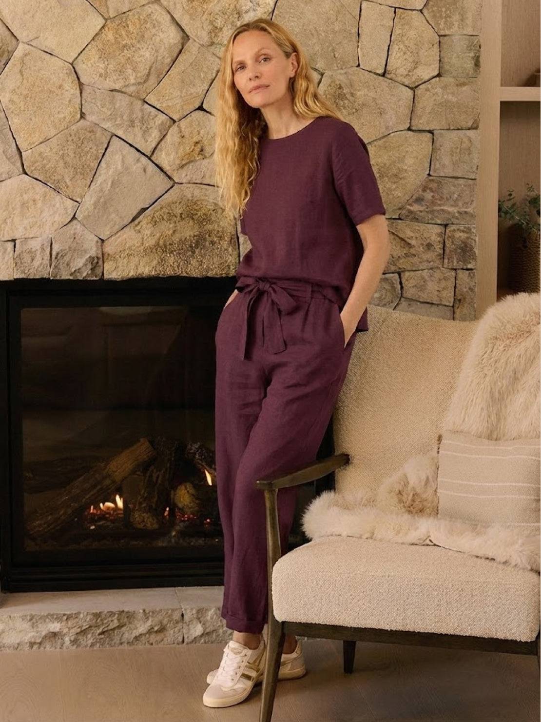 Woman wearing relaxed cotton linen set with short-sleeve top and straight-leg pants in monochrome tones