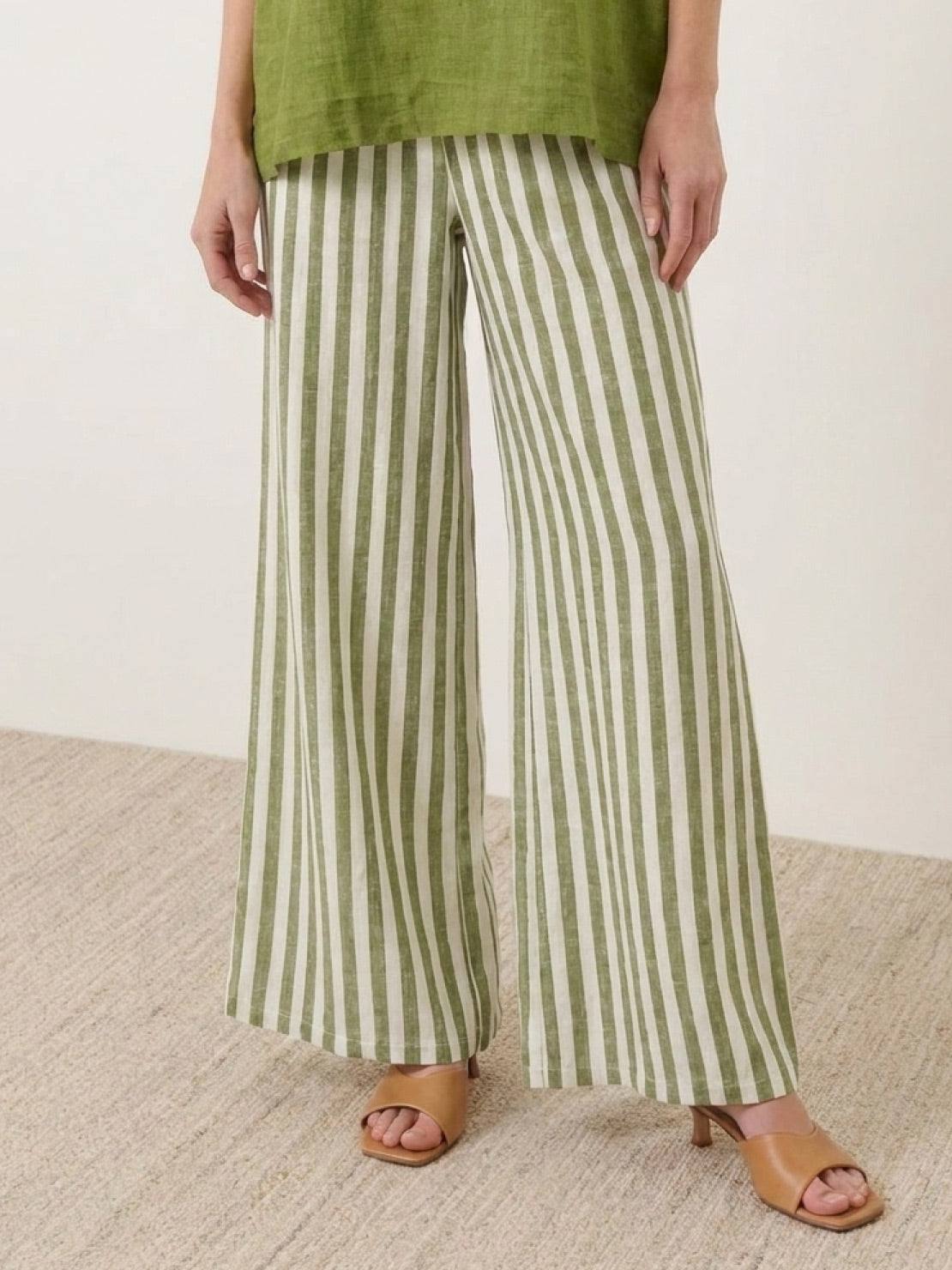 Woman wearing a striped wide-leg co-ord set with oversized top and palazzo pants