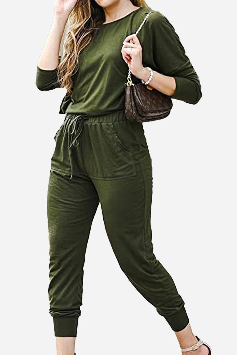 Woman wearing olive green Cozy Chic Two-Piece Sweatsuit set with long-sleeve top and high-waisted pants with pockets.