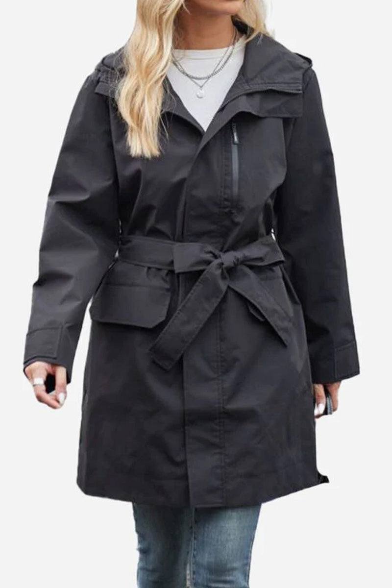 Black water-resistant windbreaker trench jacket with adjustable belt and front zipper on woman