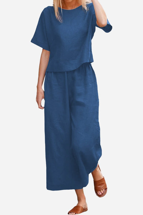 Women's loose fit co-ord set with wide-leg pants and relaxed short sleeve top in solid blue.