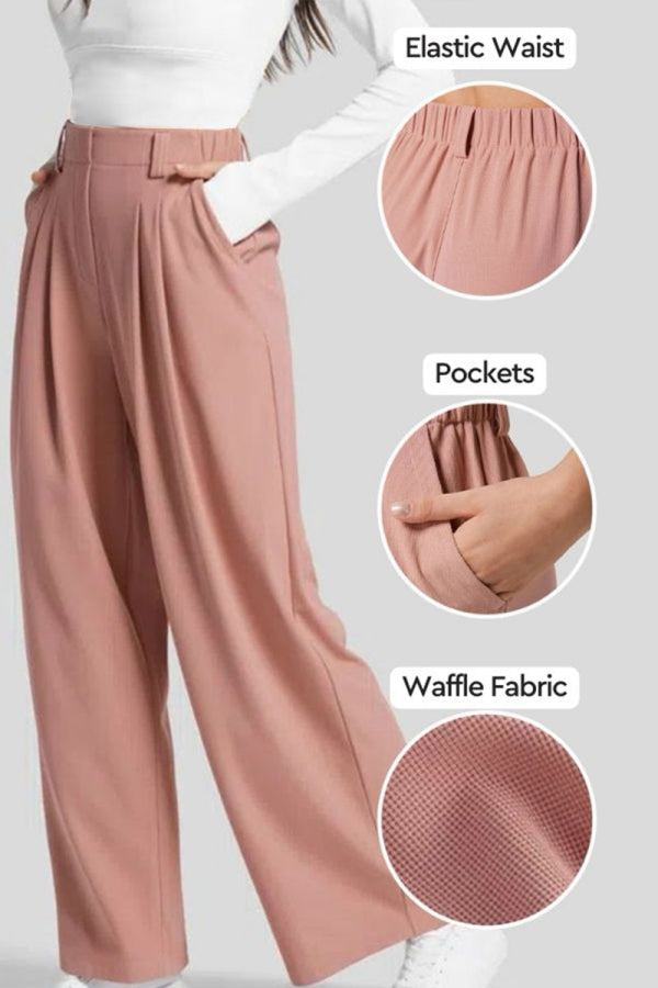 High-waisted plicated wide leg waffle pants in pink with elastic waist, pockets, and textured waffle fabric