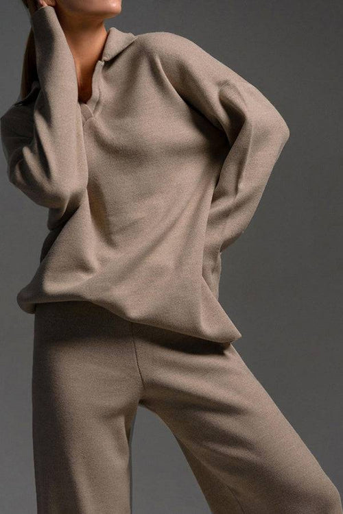 Plush & Preppy camel two-piece set featuring a knitted pullover with polo collar and wide-leg pants for comfortable travel and leisure.