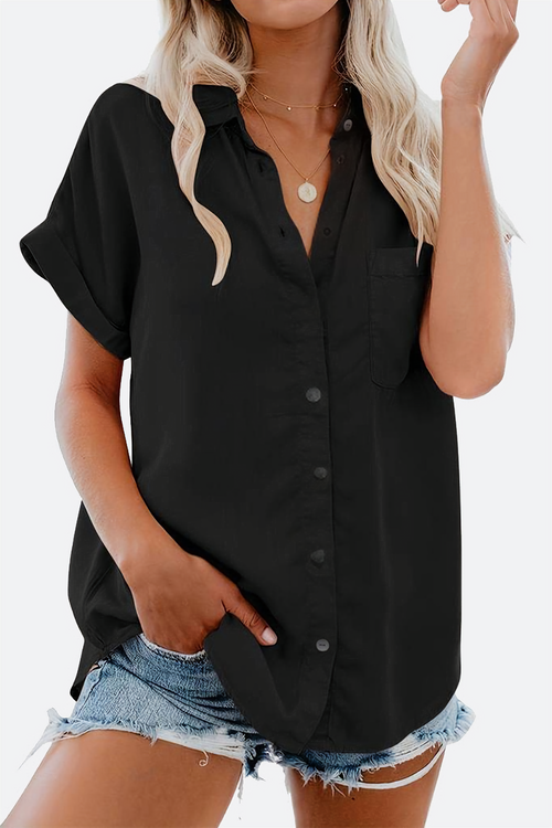 Black V-neck collared button blouse with rolled short sleeves and front pocket worn with denim shorts