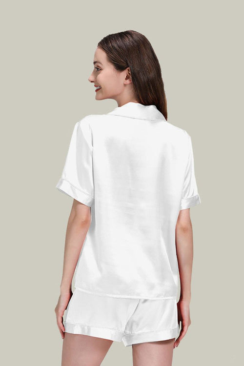 Woman wearing white Mulberry Silk Essentials buttoned short set nightwear, back view, soft breathable silk pajamas