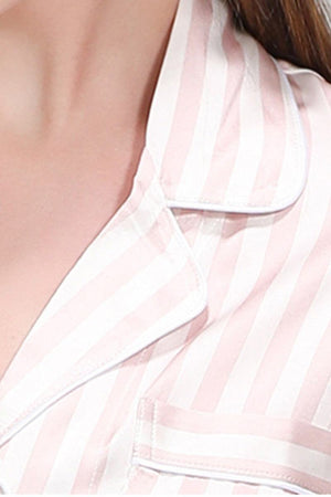Close-up of 100% mulberry silk pink and white striped long sleeve pajama top collar and pocket detail