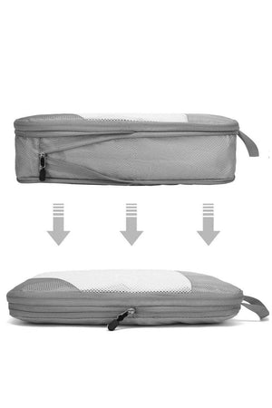 Gray space-saving compression packing organizer bag showing expanded and compressed sizes with zipper and mesh top for travel packing efficiency.