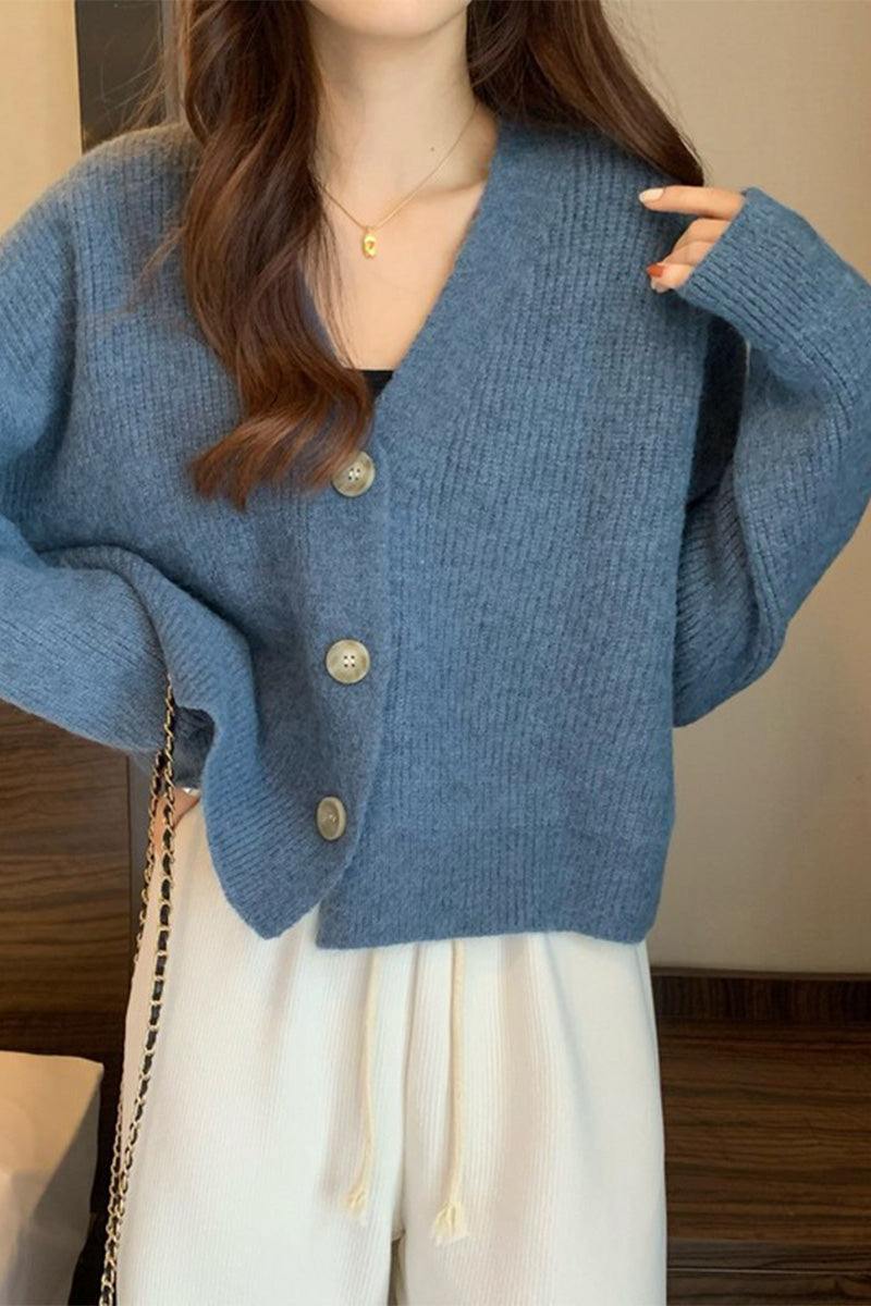 Blue casual loose boxy cardigan with buttons and relaxed fit on woman