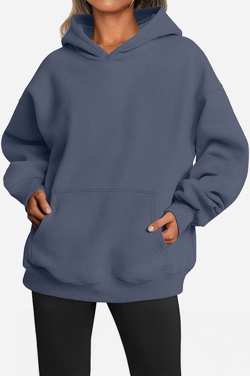Oversized fleece-lined hoodie in blue with front pocket and relaxed fit for warmth and comfort