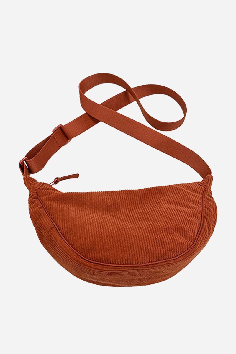 Brown corduroy shoulder bag with adjustable strap and zip closure, lightweight and roomy design.
