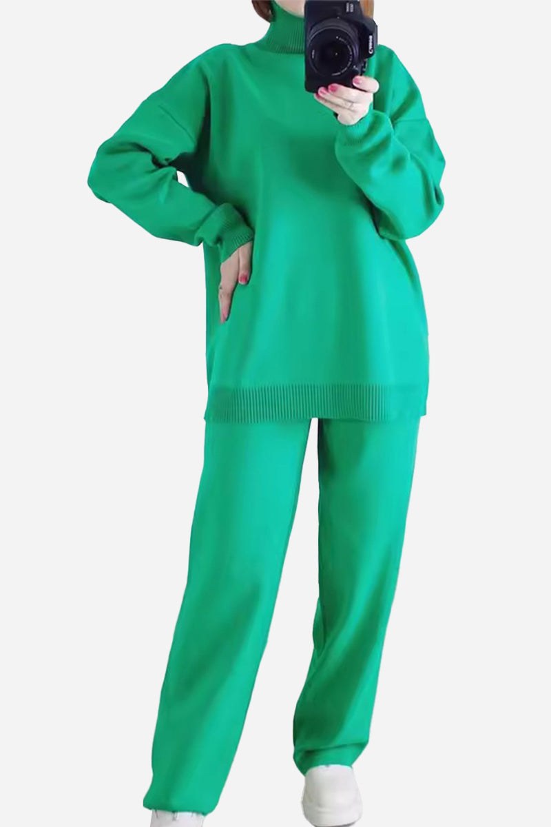 Green knitted turtleneck two-piece set with relaxed fit sweater and wide-leg pants.