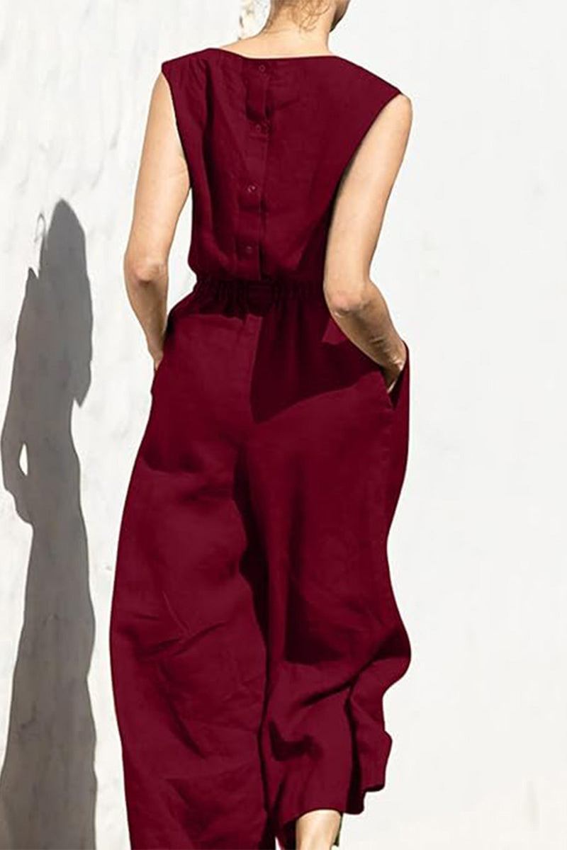 Back view of woman wearing burgundy pure cotton minimal confidence two-piece set with sleeveless top and wide-leg pants