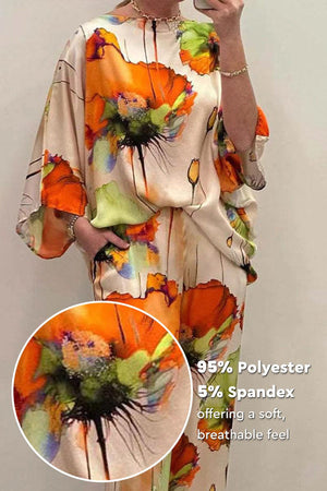 Plus size vibrant floral matching set with orange and green floral print, made of soft breathable polyester-spandex blend.