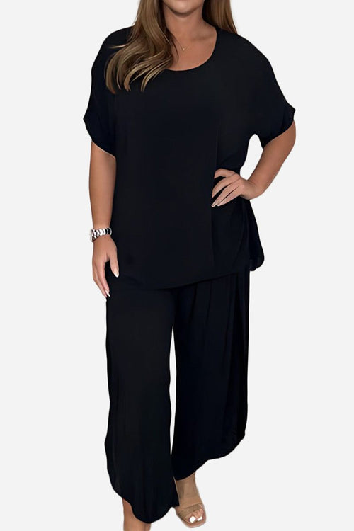 Black relaxed linen-like travel 2-piece set with loose fit top and wide-leg pants for women