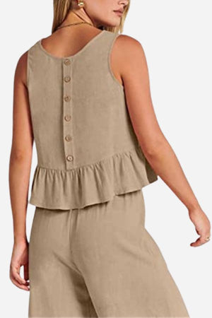 Women's beige linen-like feel set with sleeveless button-back top and wide-leg pants, lightweight and breathable for travel.