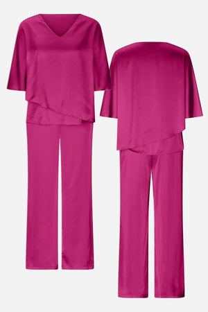 Elegant Layers two-piece set in vibrant pink with layered V-neck top and straight-leg pants, lightweight and wrinkle-resistant fabric.
