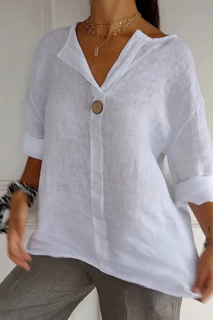 White pure linen age-defying shirt with button detail, breathable and relaxed fit for mature skin.