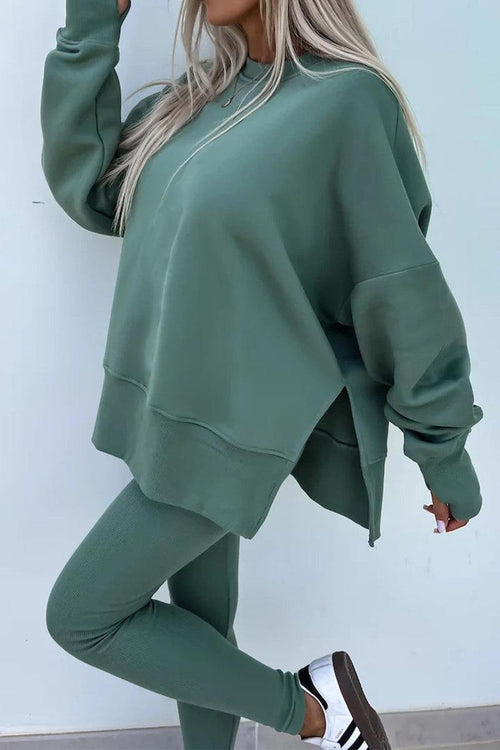 Woman wearing TimelessChic Ultra Comfortable Two-Piece Set in green, featuring a relaxed top and high-waisted leggings.