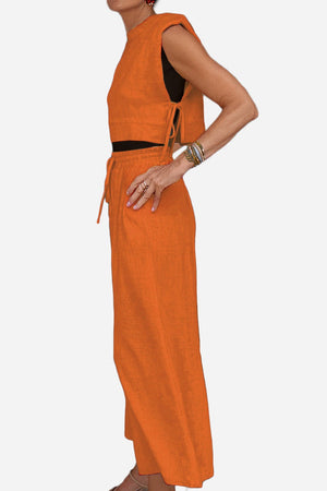 Woman wearing breathable cotton-linen blend orange sleeveless top and wide-leg pants two-piece set