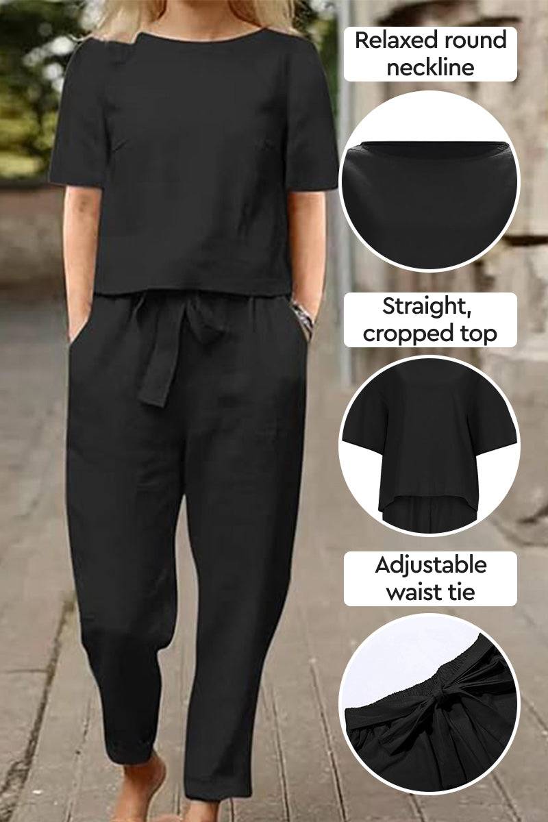 Black cotton-linen blend two-piece set with relaxed round neckline, cropped top, and adjustable waist tie.