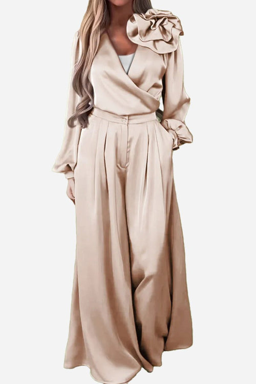 Elegant beige satin two-piece set with statement shoulder blouse and flowing palazzo pants