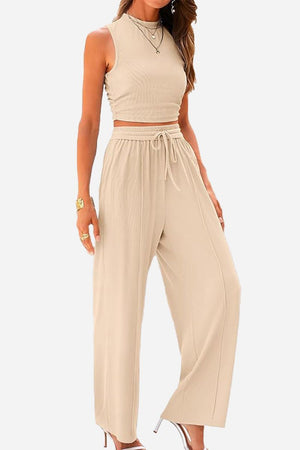 Woman wearing beige Stroll & Hangout Ribbed Knit two-piece set with sleeveless top and wide-leg pants.