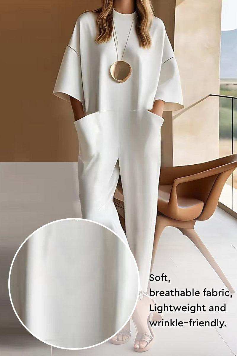 Serene Minimalist Pocket Jumpsuit in soft, breathable, wrinkle-resistant fabric with functional deep pockets and relaxed fit.