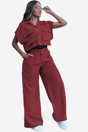 Woman wearing rust red two-piece big pocket set with cropped top and wide-leg pants