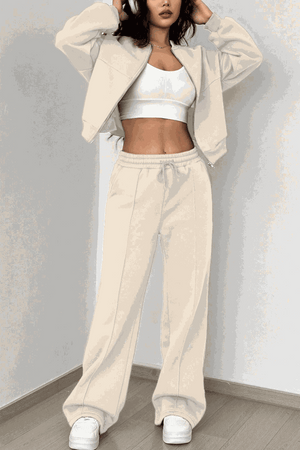 The Voyager Zip Set cream zip-front sweatshirt and wide-leg joggers travel outfit