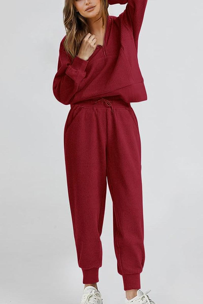 Unisex half-zip pullover and sweatpants set in burgundy, soft polyester blend, casual and comfortable lounge wear.