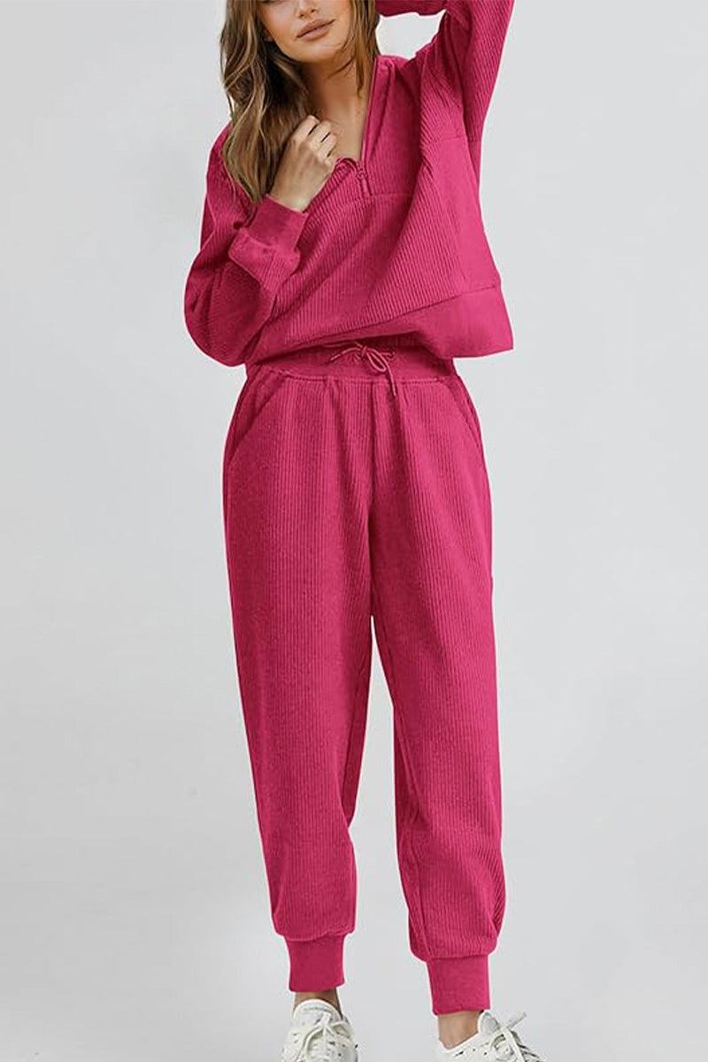 Unisex half-zip pullover and sweatpants set in pink polyester blend for cozy casual wear