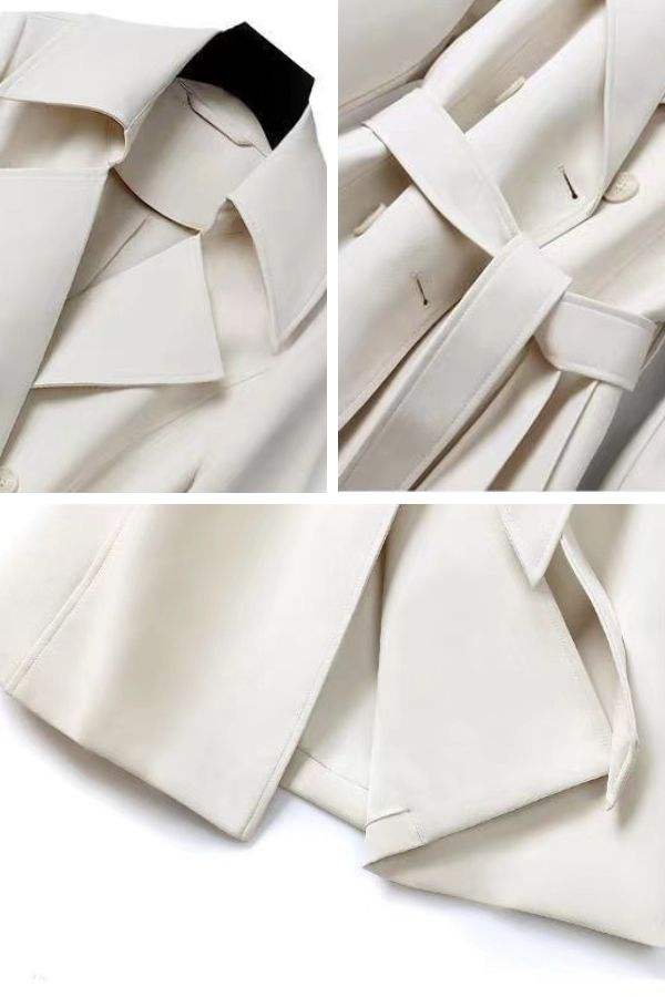 Close-up details of timeless retro belted trench coat showing collar, adjustable waist belt, and smooth structured fabric in beige.
