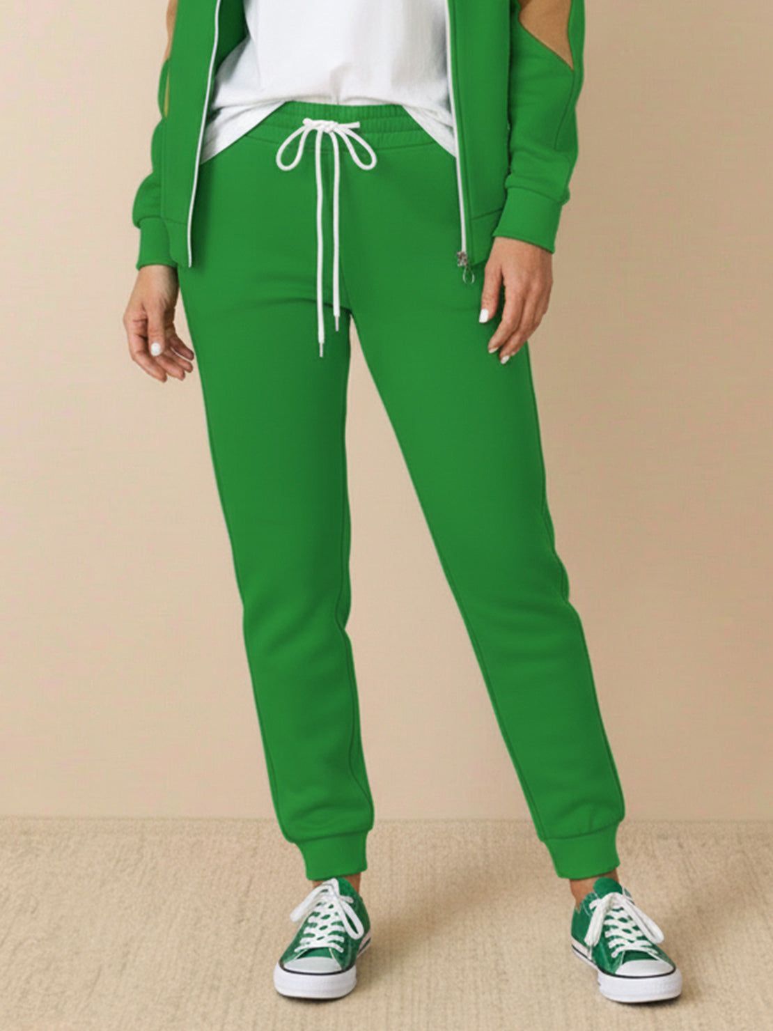 Colorblock comfort tracksuit with contrast curved panels and relaxed fit for a slimming, wrinkle-resistant look.