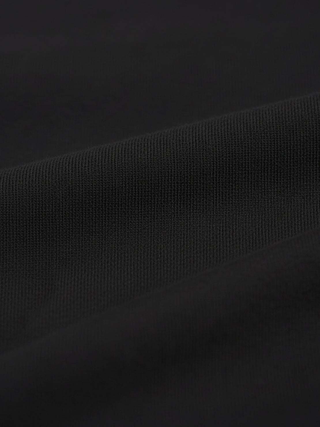 Wrinkle-free two-piece polo set with quarter-button top and high-waisted pants in breathable, structured fabric