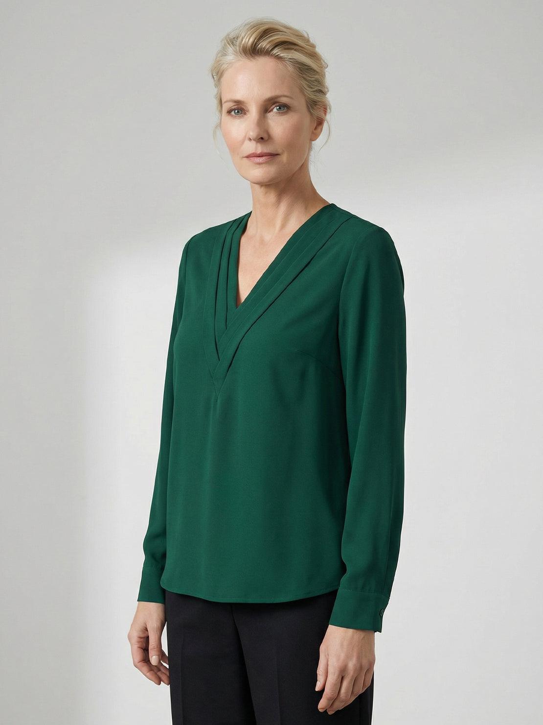 White pleated V-neck long-sleeve blouse with button cuffs and relaxed fit