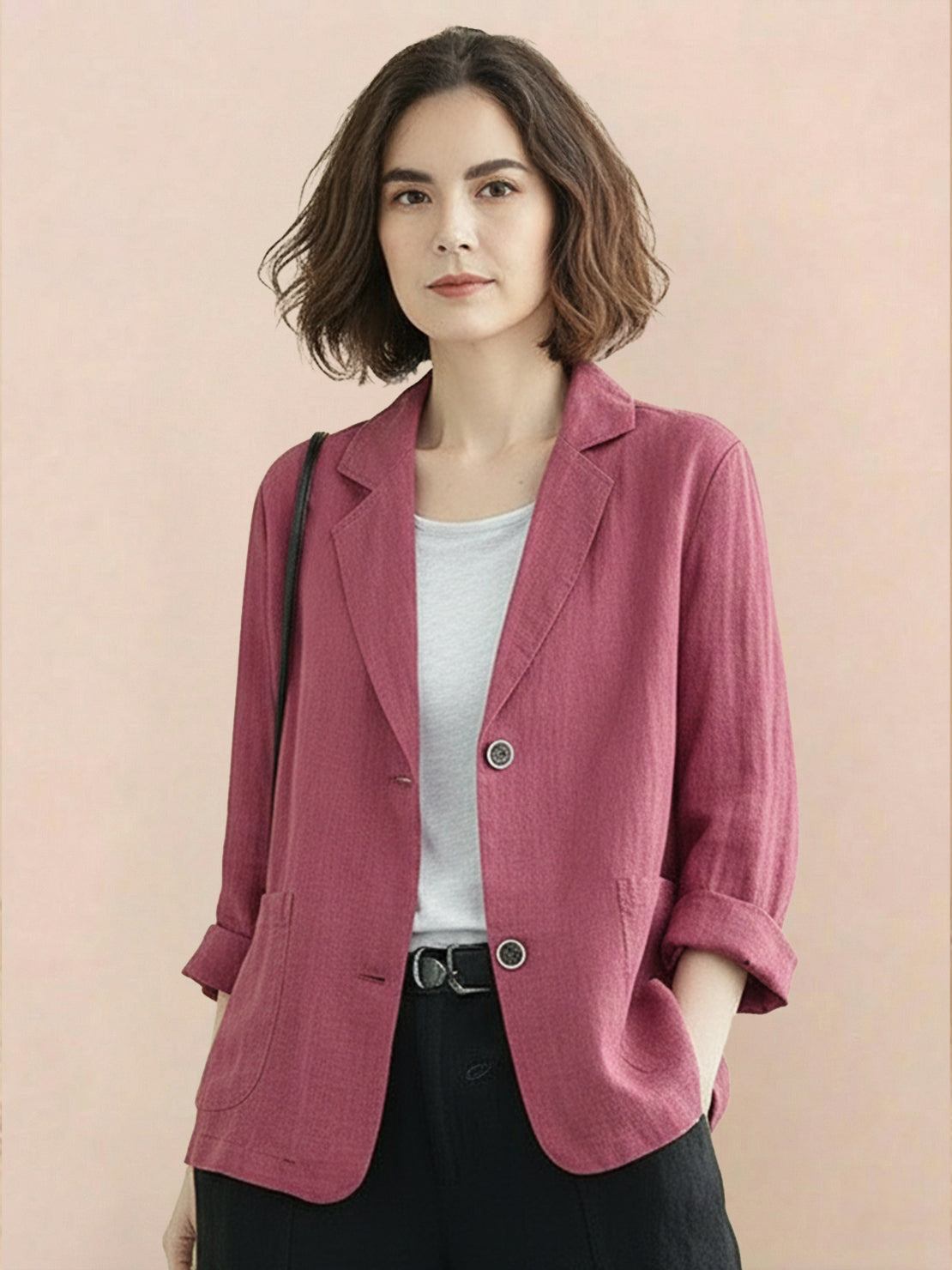 Cotton-linen blazer with relaxed fit, notch lapels, two-button closure, and natural textured fabric.
