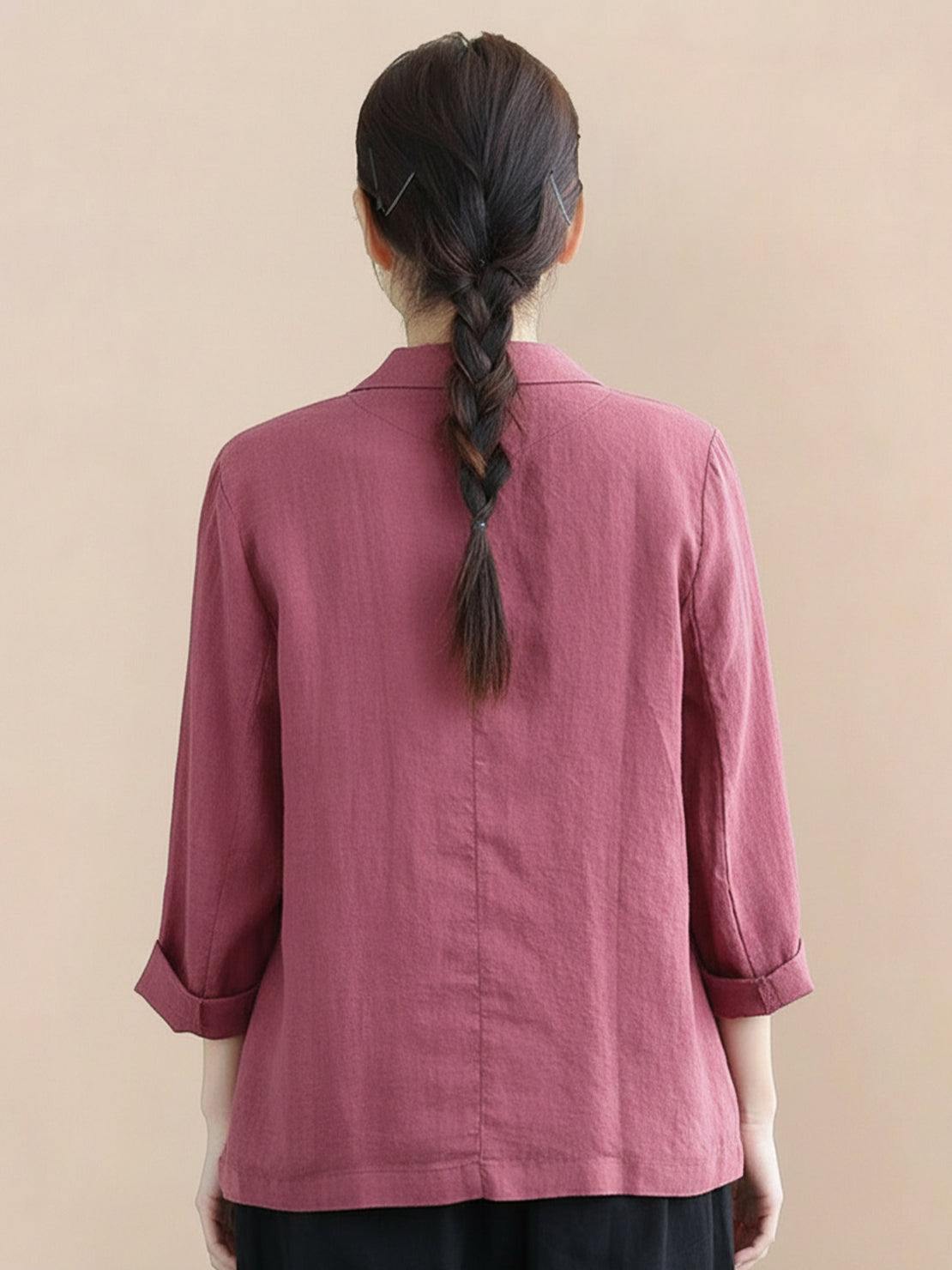 Hip-length cotton-linen blazer with notch lapels, two-button closure, and natural textured fabric