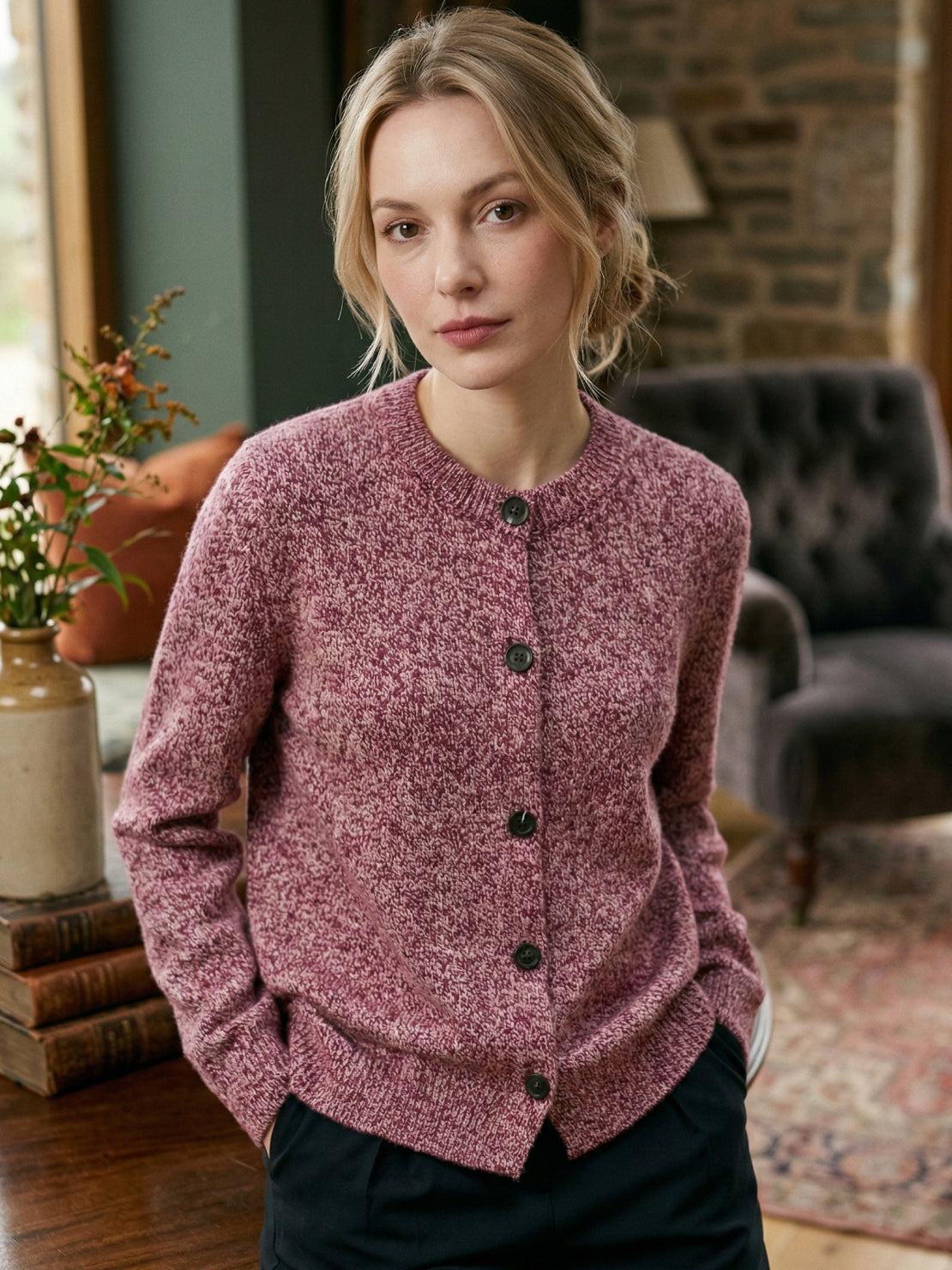 Marled knit merino wool cardigan with dark buttons and ribbed cuffs, relaxed fit.