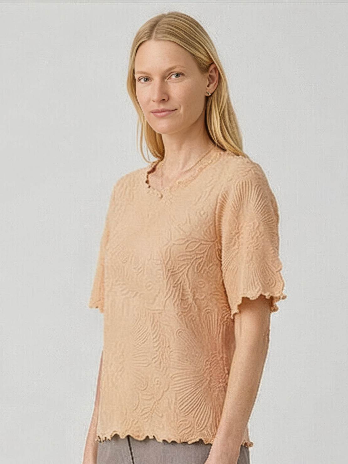 White floral jacquard pleated top with flutter sleeves and lettuce-edge trim