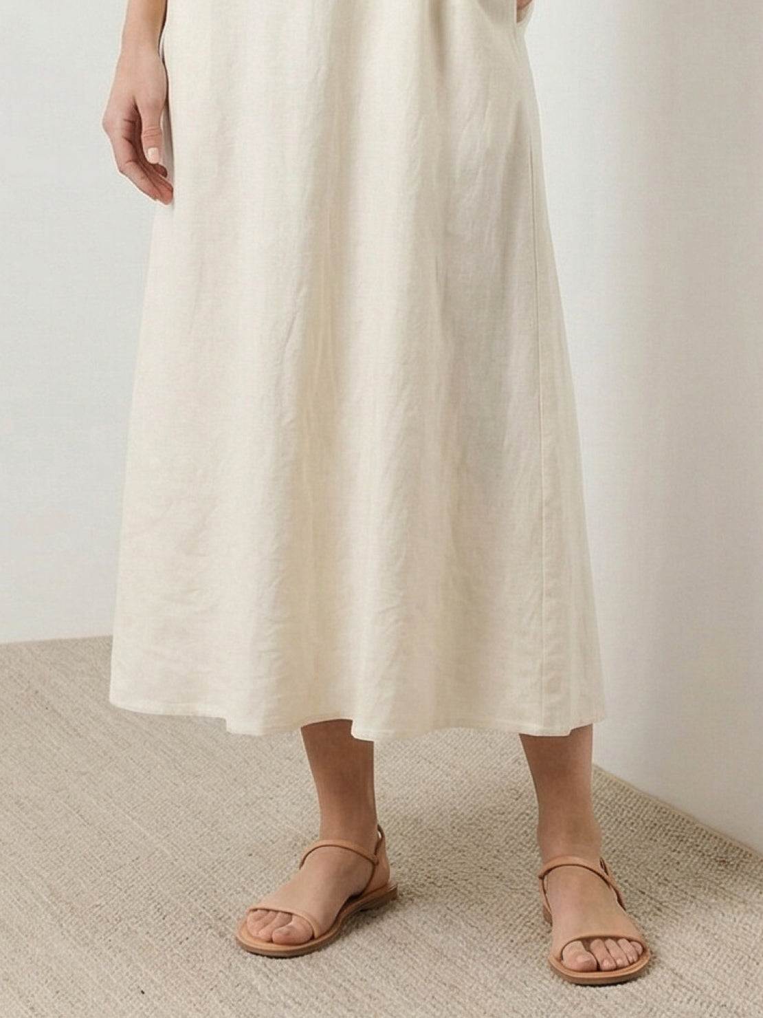 Lightweight cotton linen sleeveless maxi dress with round neckline and flowing ankle-length silhouette