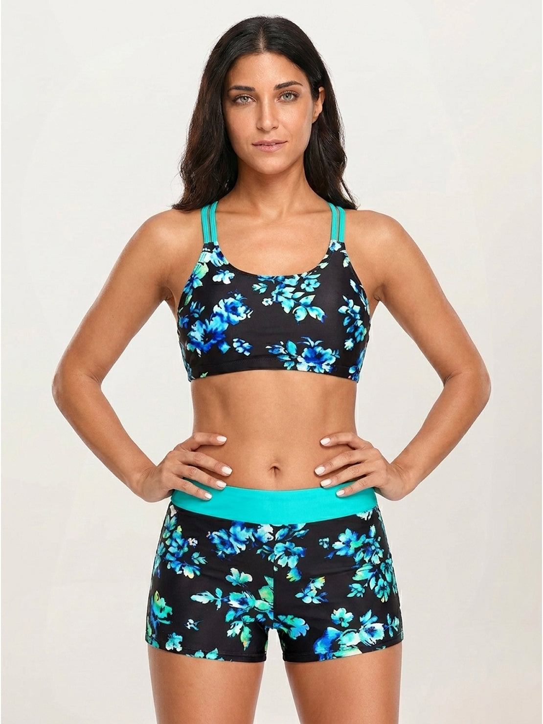 Three-piece tankini set with criss-cross back design and printed sports bra and boy shorts