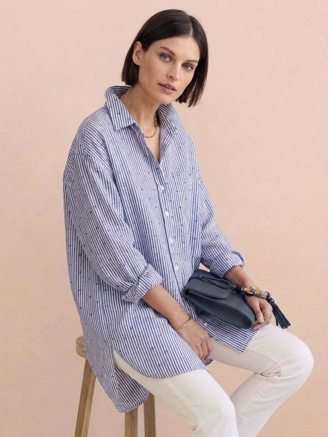 Oversized linen shirt in relaxed fit with back-pleat button detail and dropped shoulders