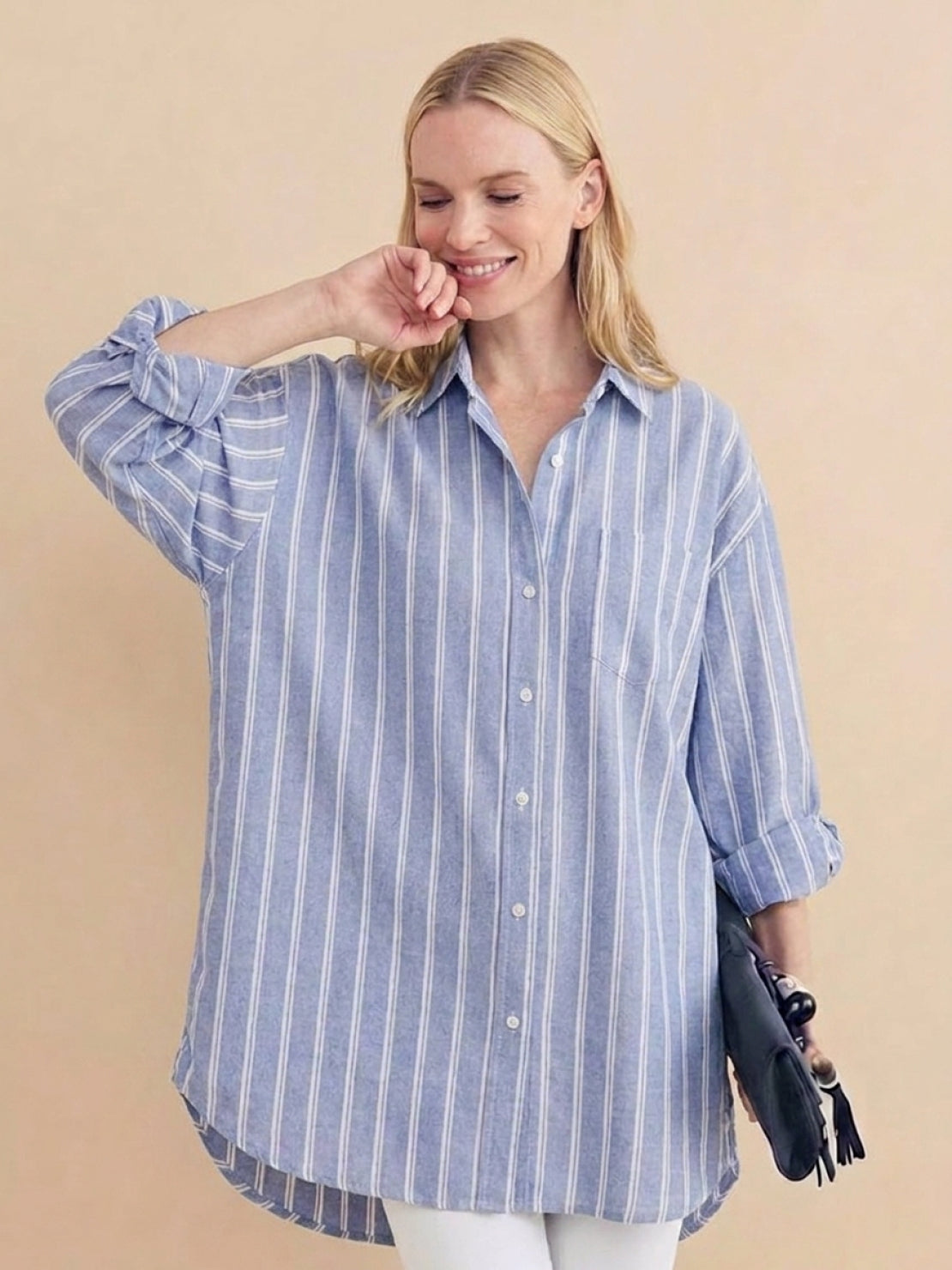 Oversized linen shirt with relaxed fit, back-pleat detail, and chest pocket in coastal stripe pattern
