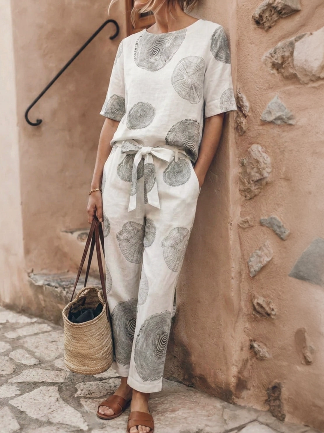 model wearing relaxed cotton linen set with monochrome short-sleeve top and drawstring pants