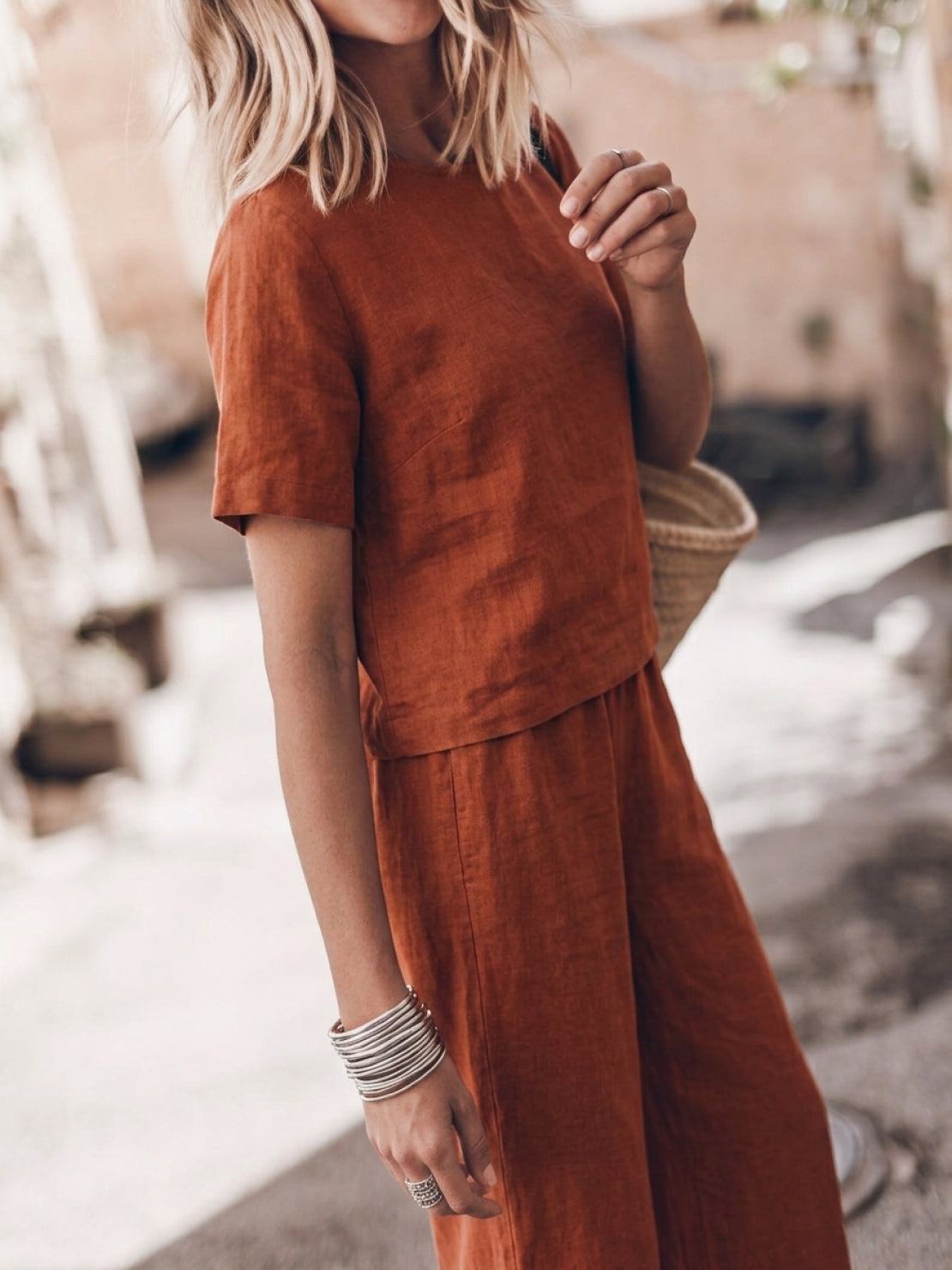 woman wearing soft cotton loose fit co-ord set with short sleeves and wide-leg trousers
