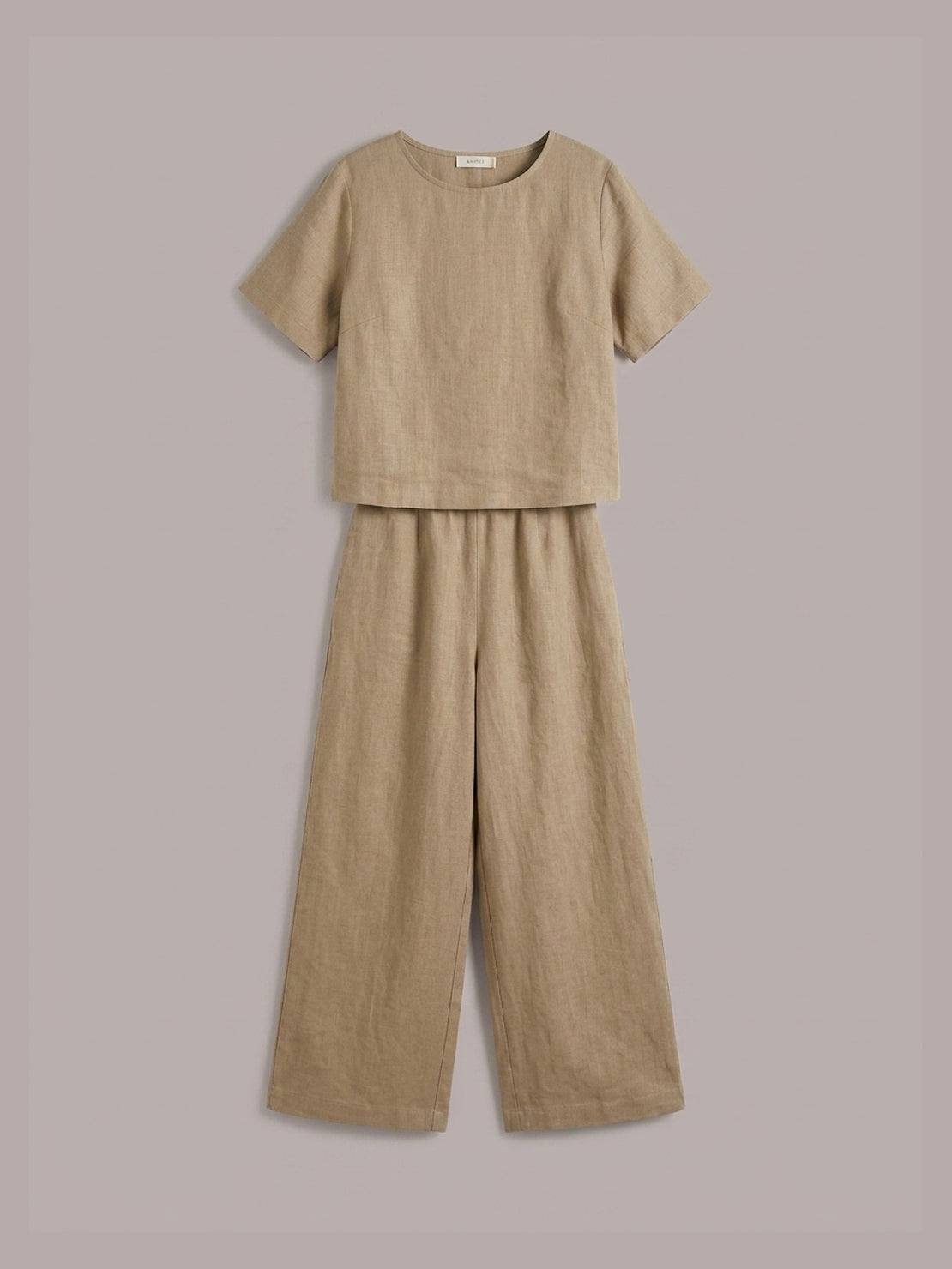 woman wearing soft-tailored loose fit co-ord set with wide-leg trousers in light cotton fabric
