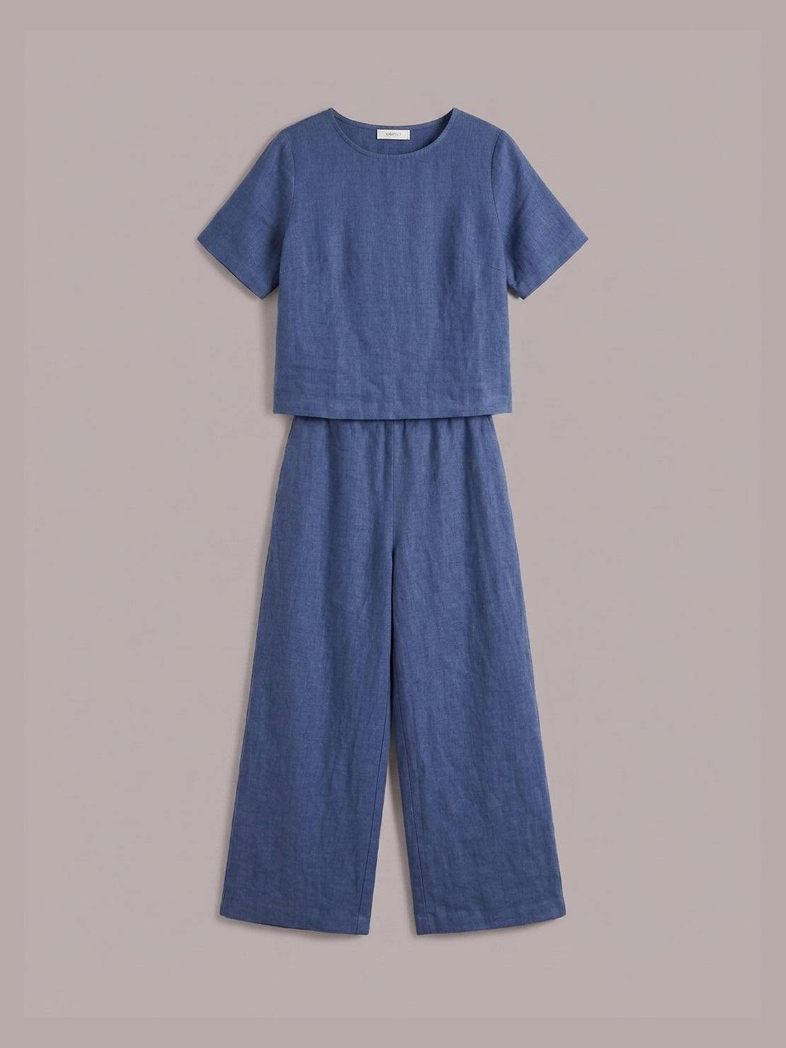 Woman wearing a soft cotton loose fit co-ord set with wide sleeves and wide-leg trousers in relaxed style