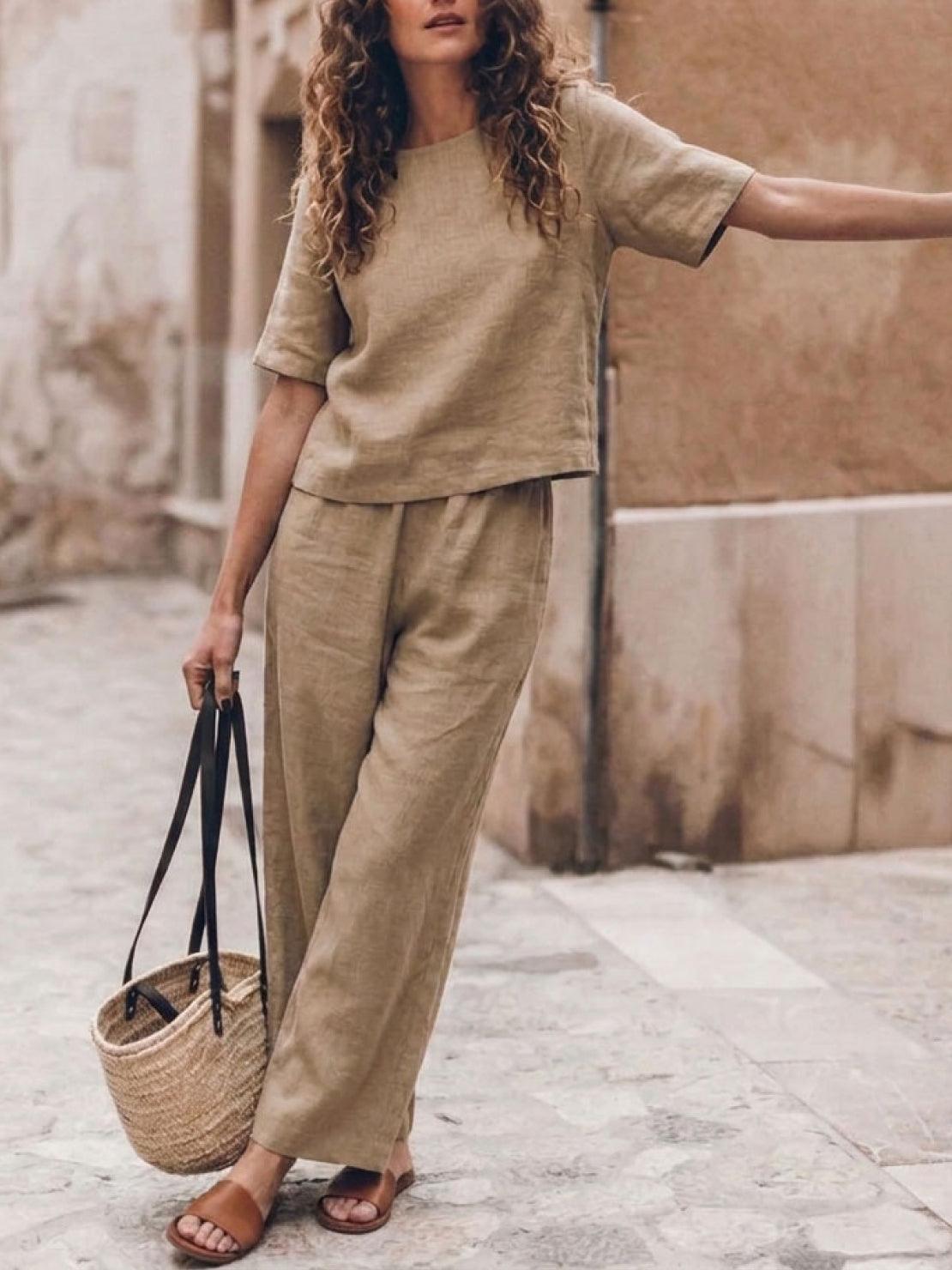 woman wearing loose fit co-ord set with soft-tailored top and wide-leg bottoms in breathable cotton