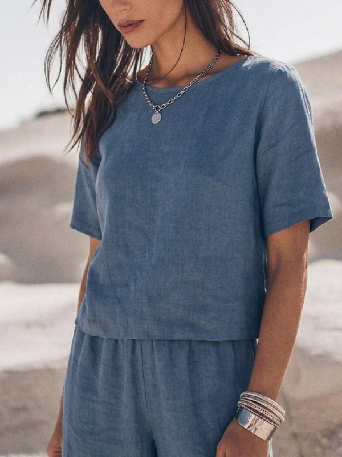 Woman wearing a soft cotton loose fit co-ord set with wide-leg pants and a relaxed short-sleeve top